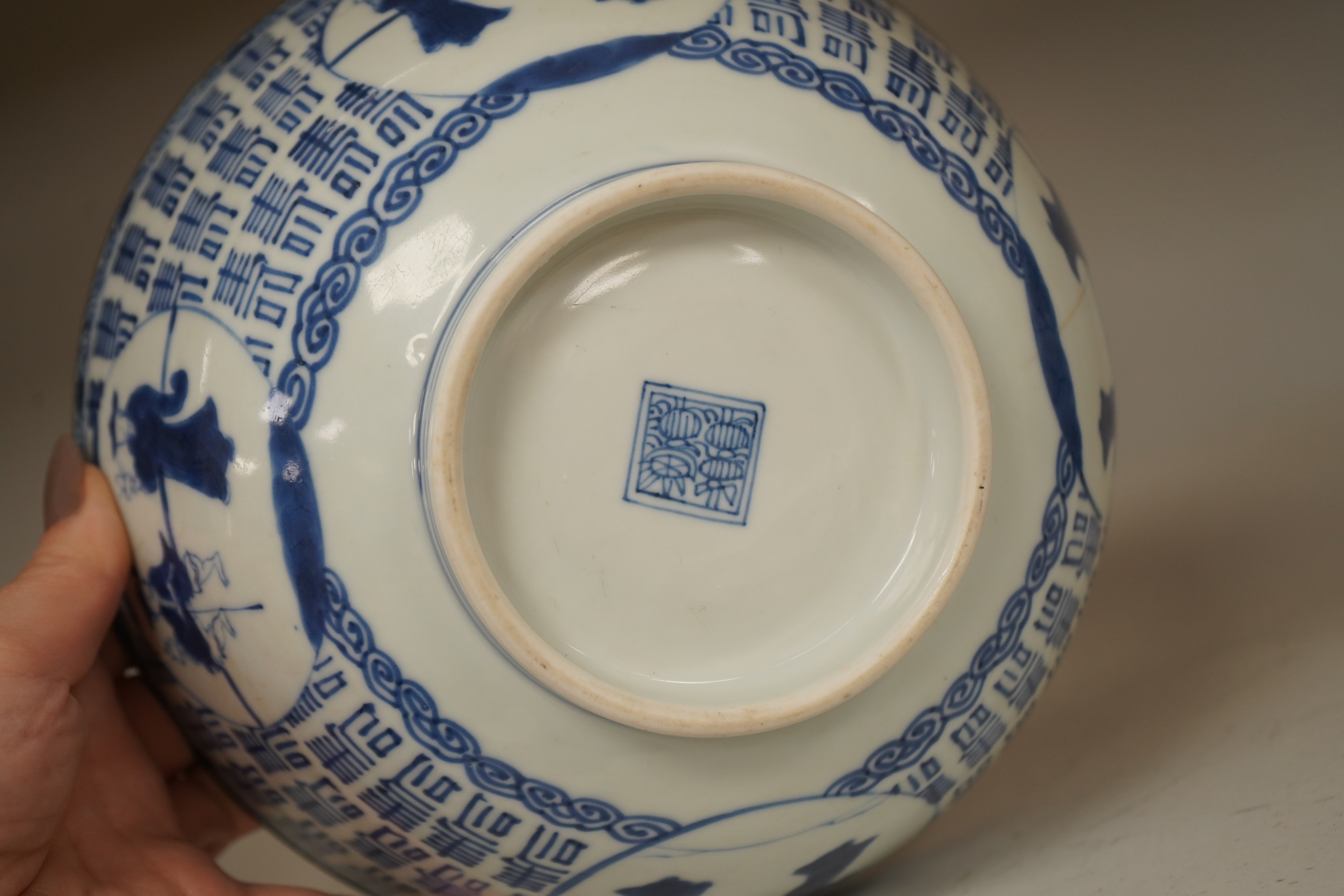 A Chinese blue and white ’Hundred Shou’ bowl, Qing dynasty, 20cm in diameter. Condition - cracked